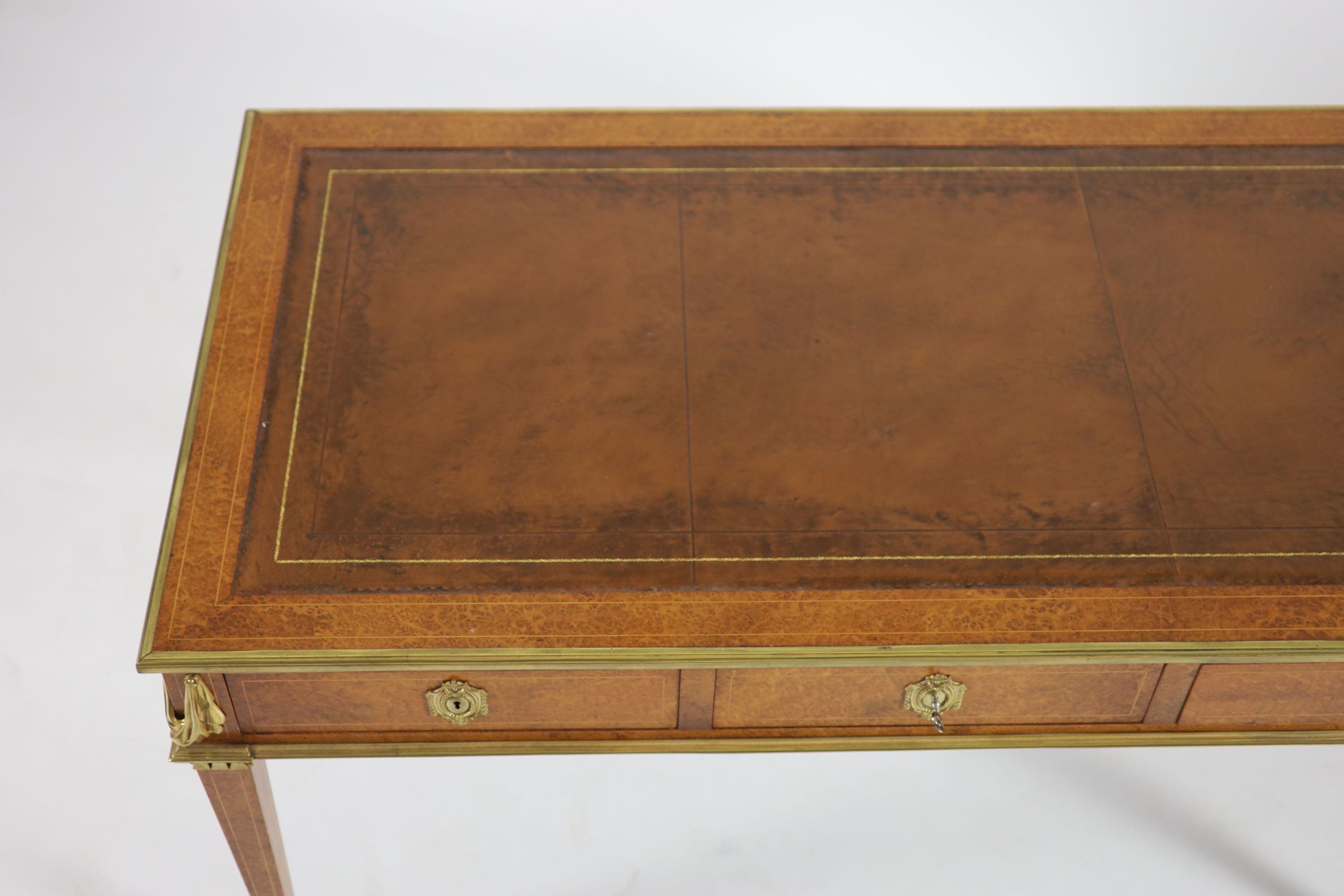 Laporte Barmen. A Louis XVI style ormolu mounted burr wood bureau plat, W.142cm D.76cm H.77cm